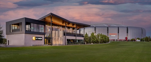 Exterior view of Flanker Kitchen + Sporting Club with BetMGM branding and modern architecture.